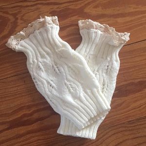 Cream leg warmers with lace tops.